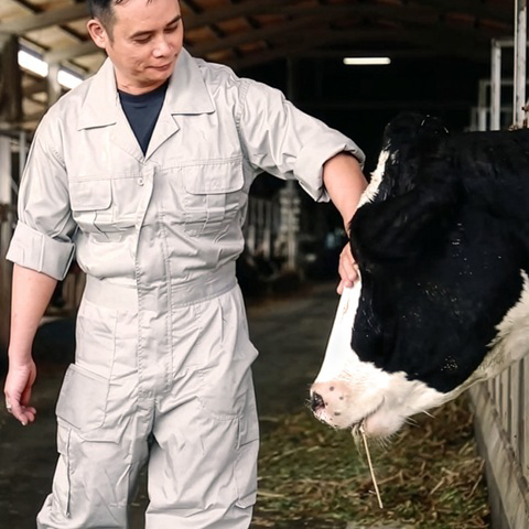 Trained technician conducting hands-on animal welfare inspection.